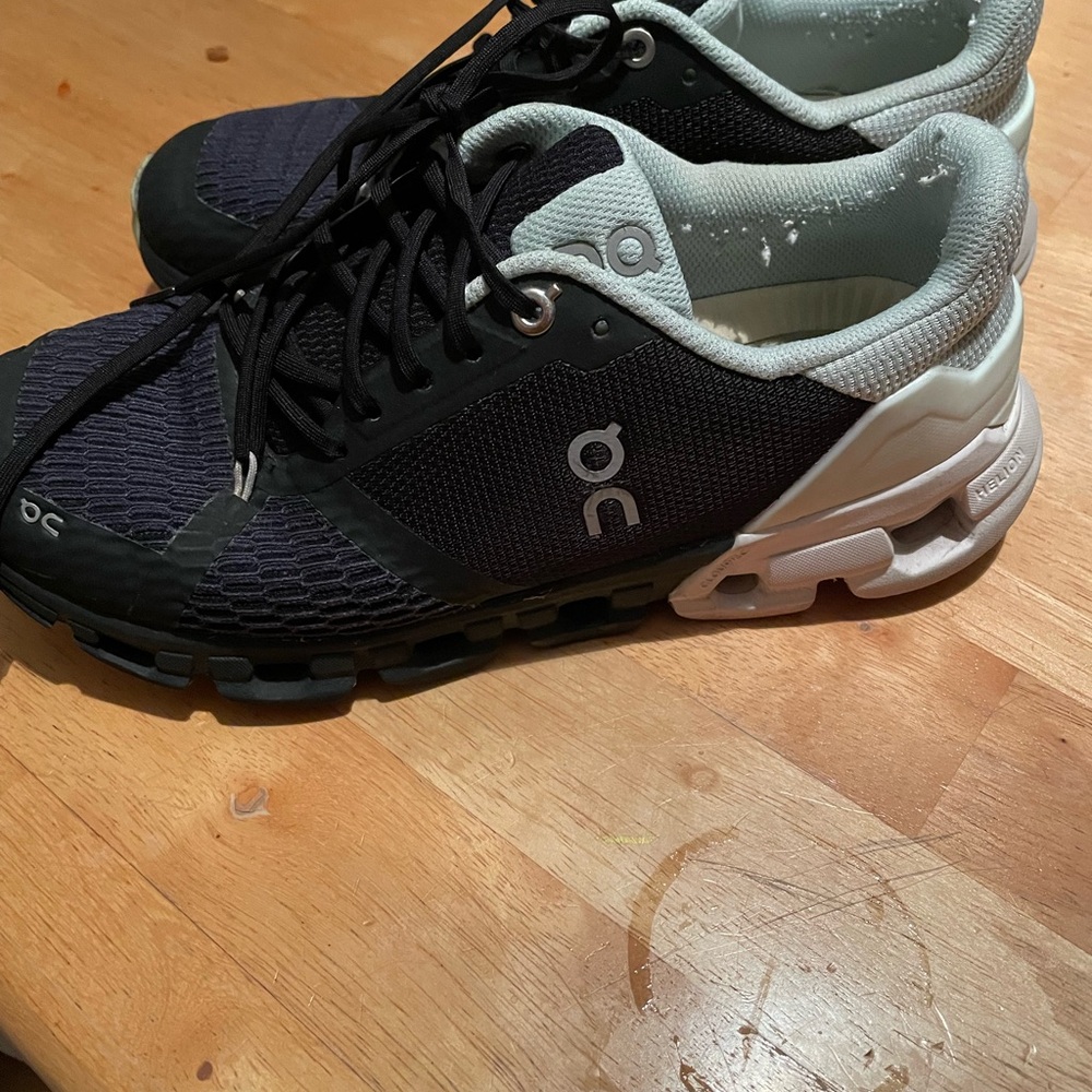 On Cloud Athletic Sneakers in Black and mint green.